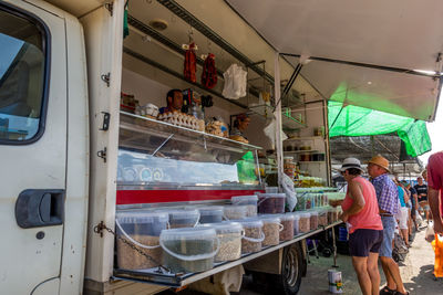 Rear view of people working in train