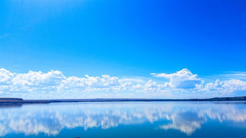 Scenic view of sea against clear blue sky