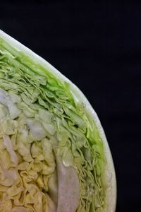 Close-up of lemon slice over black background