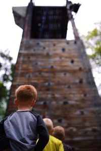 Rear view of girl looking at camera