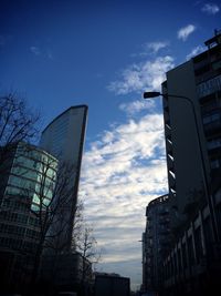 Low angle view of building against cloudy sky