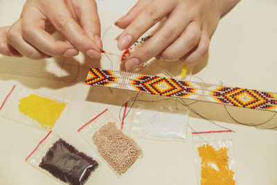 Cropped hand of woman holding gift