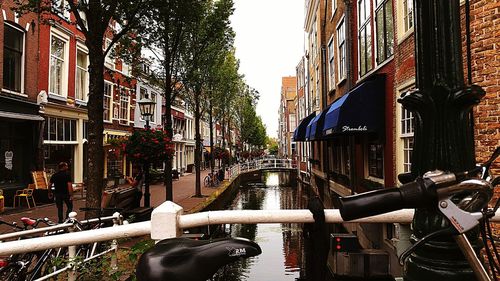 View of street amidst buildings in city