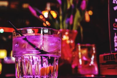 Close-up of wine glasses on table