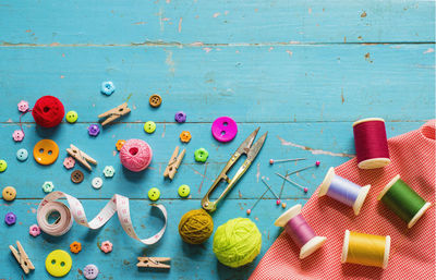 High angle view of multi colored buttons on table