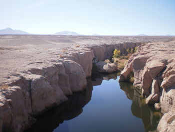 Scenic view of rocky mountains against clear sky