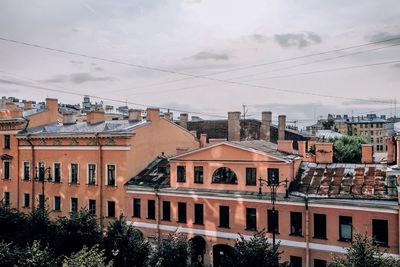 Buildings in city against sky