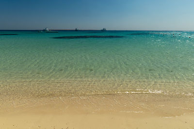 Scenic view of sea against clear sky