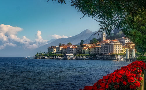 Scenic view of sea against buildings