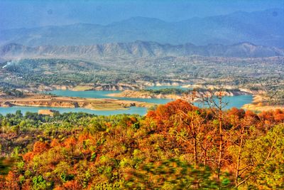 Scenic view of landscape and mountains against sky