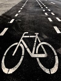 High angle view of bicycle sign on road