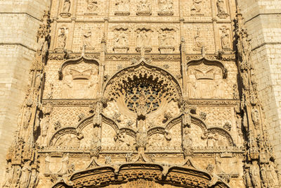 Low angle view of carvings on wall of building