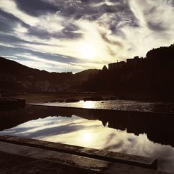 Scenic view of lake against sky during sunset