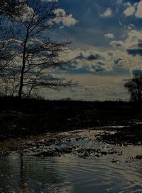 Scenic view of lake against sky at sunset