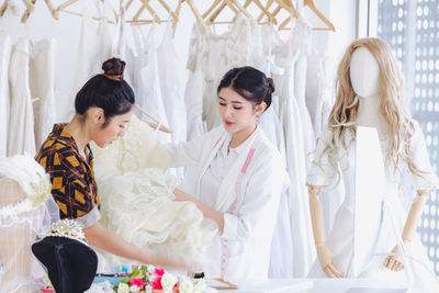 People in traditional clothing standing in room