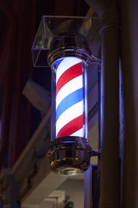 Barber's pole in a small street of singapore.