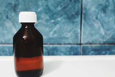 Close-up of beer bottle on table