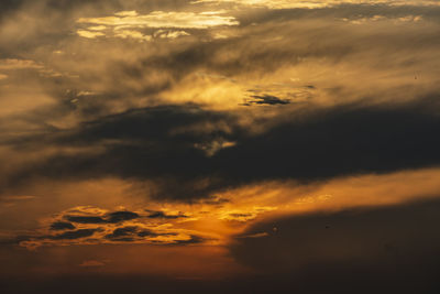 Low angle view of dramatic sky during sunset