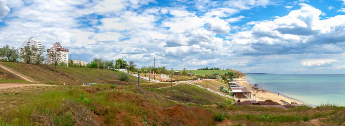 Seaside park and public beach in the city of yuzhne, ukraine. panoramic view on a sunny spring day