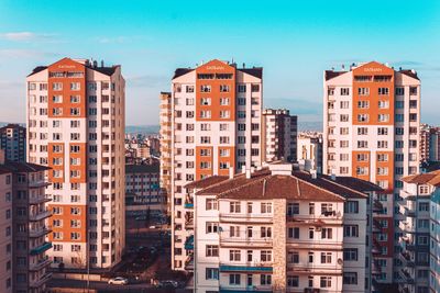 Buildings in city against sky