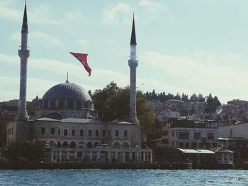 View of mosque against sky in city