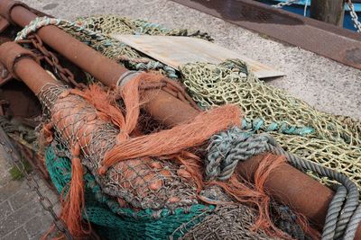 High angle view of fishing nets and buoys on pier