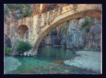 Arch bridge over river