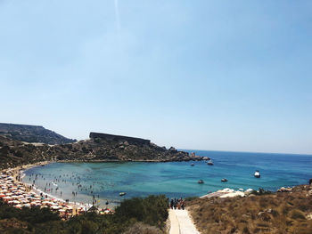 Scenic view of sea against blue sky