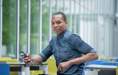 Portrait of man working on table