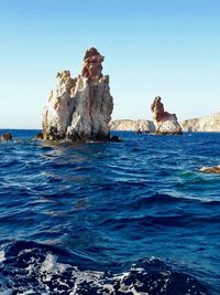 Scenic view of sea against clear blue sky