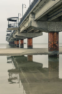 Tilt image of bridge over sea against sky