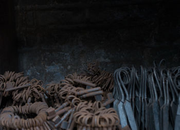 Close-up of rusty keys against wall