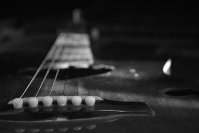 Close-up of guitar on table