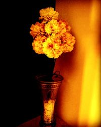 Close-up of yellow flower on table