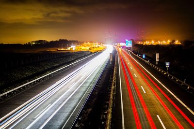 High angle view of light trails on road at night