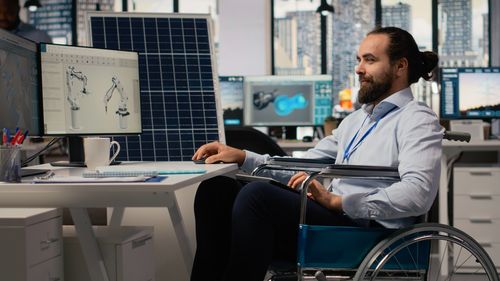 Side view of businessman working at desk in office