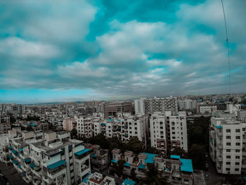 High angle view of buildings in city against sky