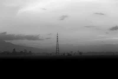 Silhouette landscape against sky