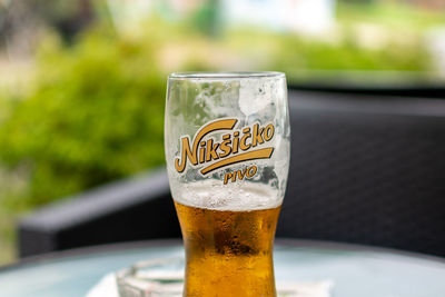 Close-up of beer glass on table