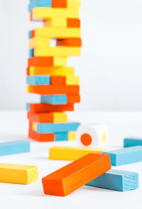 Close-up of toys on table against white background