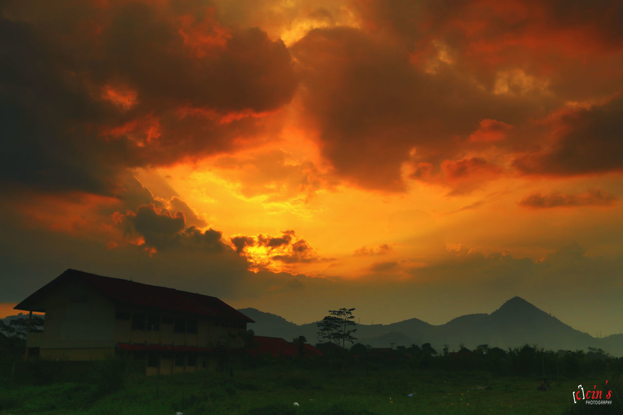 SCENIC VIEW OF MOUNTAINS AGAINST DRAMATIC SKY