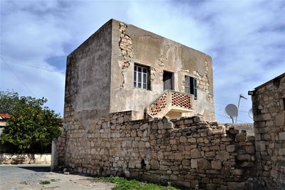 Low angle view of old building against sky