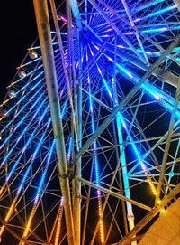 Low angle view of illuminated ferris wheel