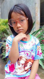 Portrait of girl standing outdoors