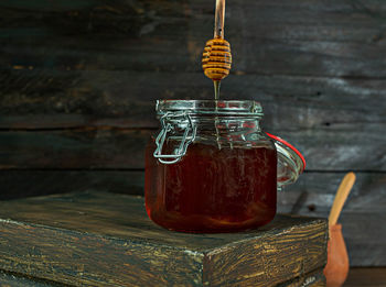 Close-up of glass jar on table