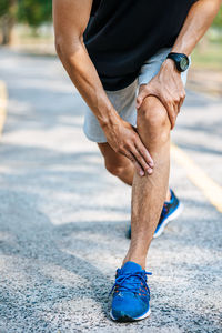 Low section of man running on floor