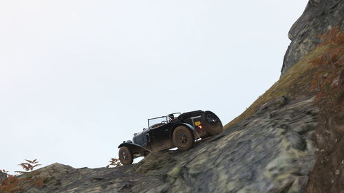 Low angle view of rocks against clear sky