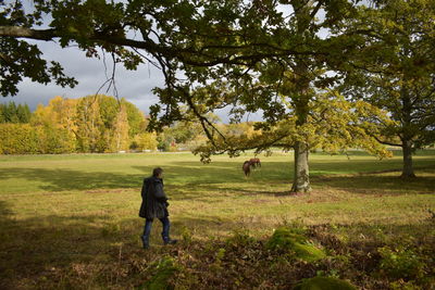 Rear view of man on field