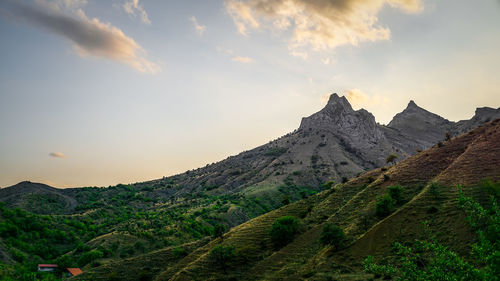 View of mountain range against cloudy sky