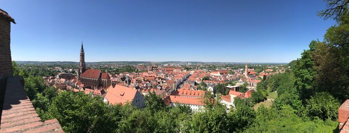 High angle view of townscape against clear blue sky